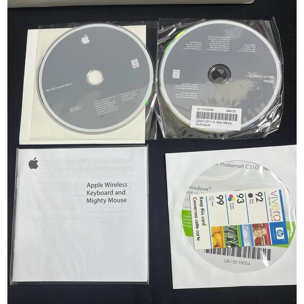 Apple A1197 mouse, A1156 Remote, OS X CDs. Sell As Is